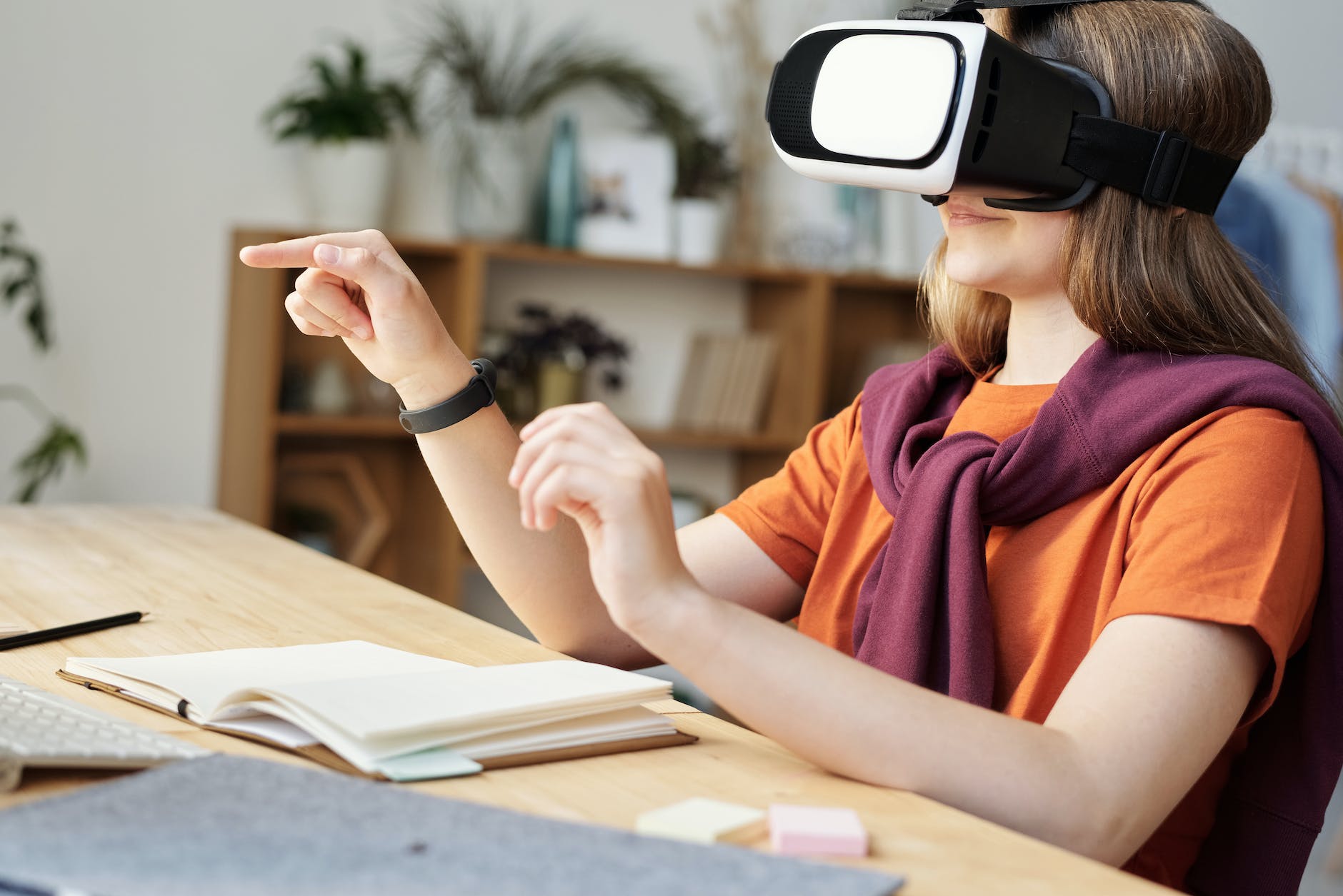 girl wearing black and white vr goggles